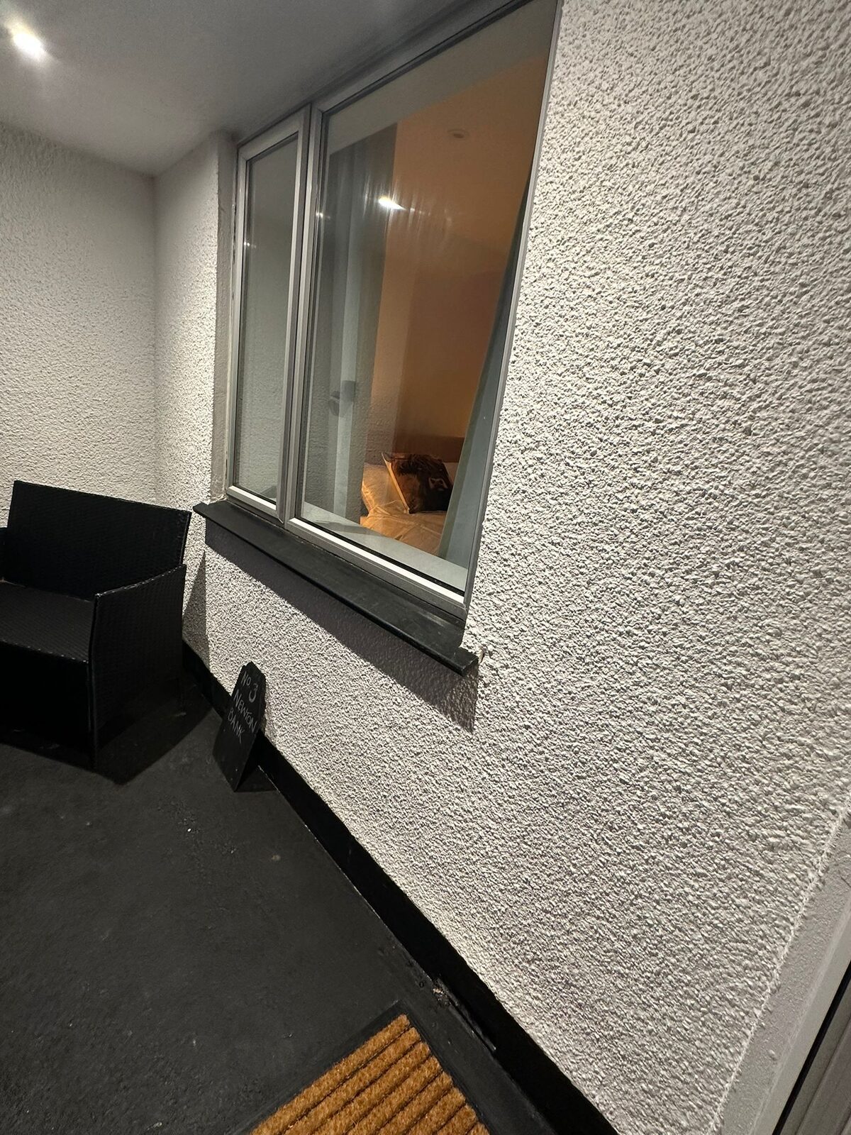 Bedroom with Highland cow cushions and warm bedside lighting